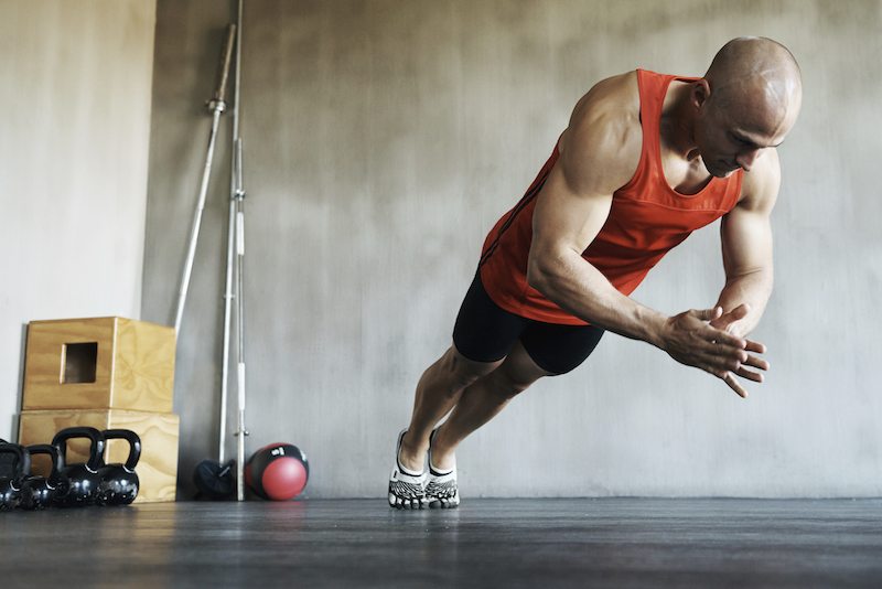 Shot of a handsome young man working out in the gym