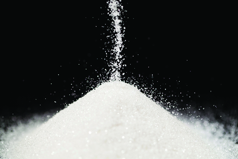 The sugar lies on the black background