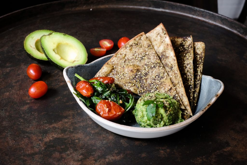 The avocado toast flatbread from Mana, part of their healthy brunch menu.