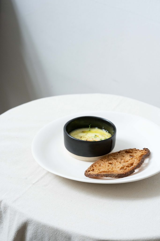 Baked eggs in a small dish at Nectar, part of the healthy brunch menu.