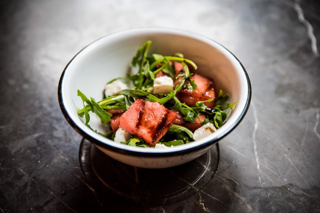 A char grilled watermelon and feta salad, with rocket and balsamic dressing.