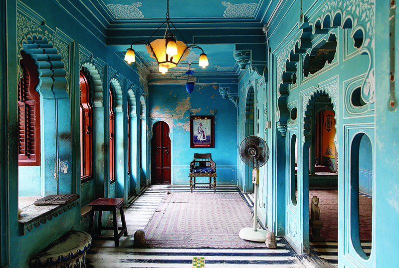 A blue foyer at a temple in India, which is a popular destination for female solo travellers in Asia.