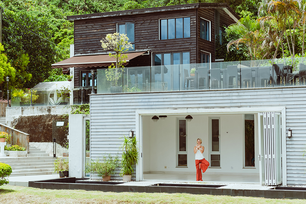 a woman does yoga at bliss body retreats, a hong kong yoga retreat