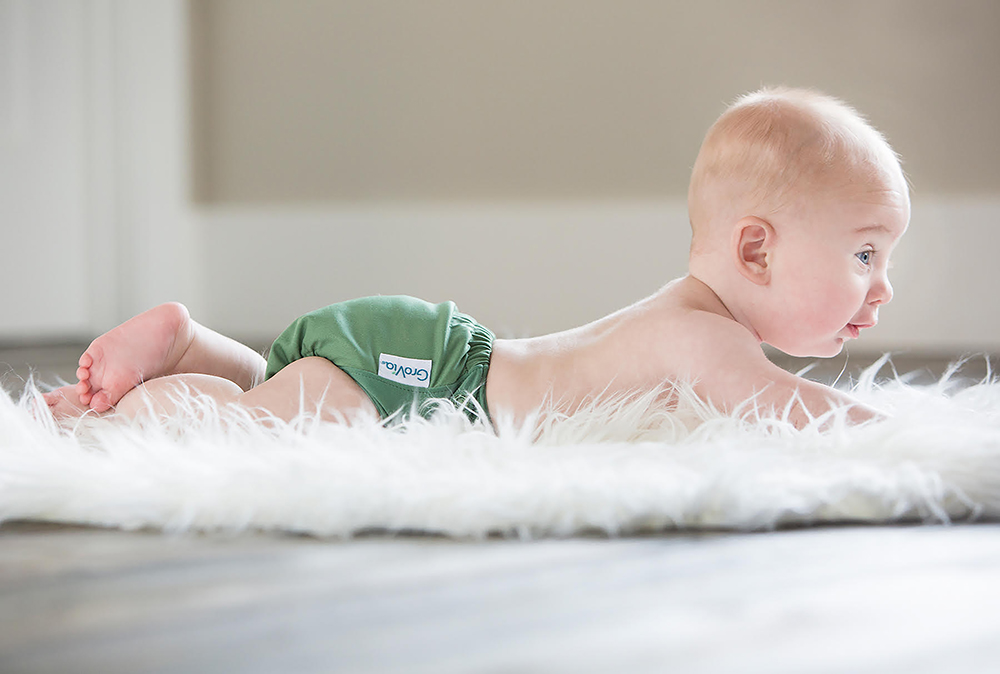 a baby in a disposable diaper, an eco friendly idea for parents