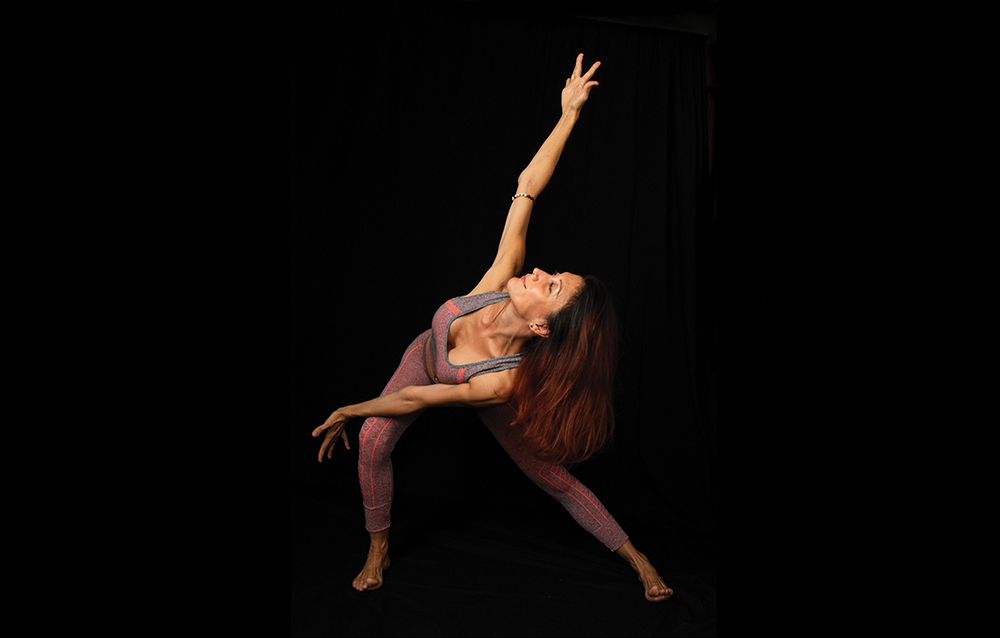 Lisa Souissa, a guest practitioner of gyrokinesis at Mandarin Oriental, performs a stretch