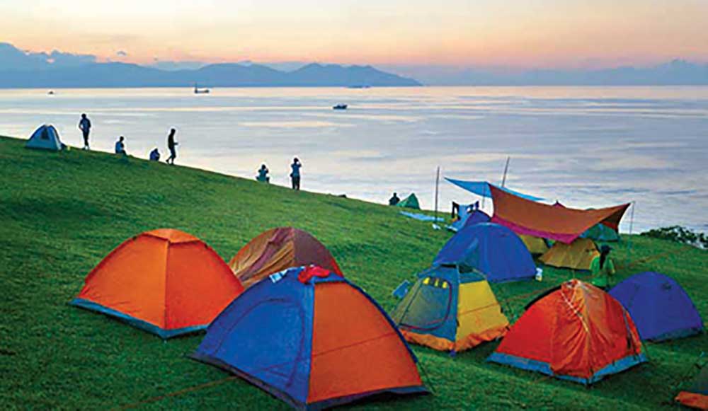 Tents on the grass at Tap Mun, a popular family-friendly campsite in Hong Kong