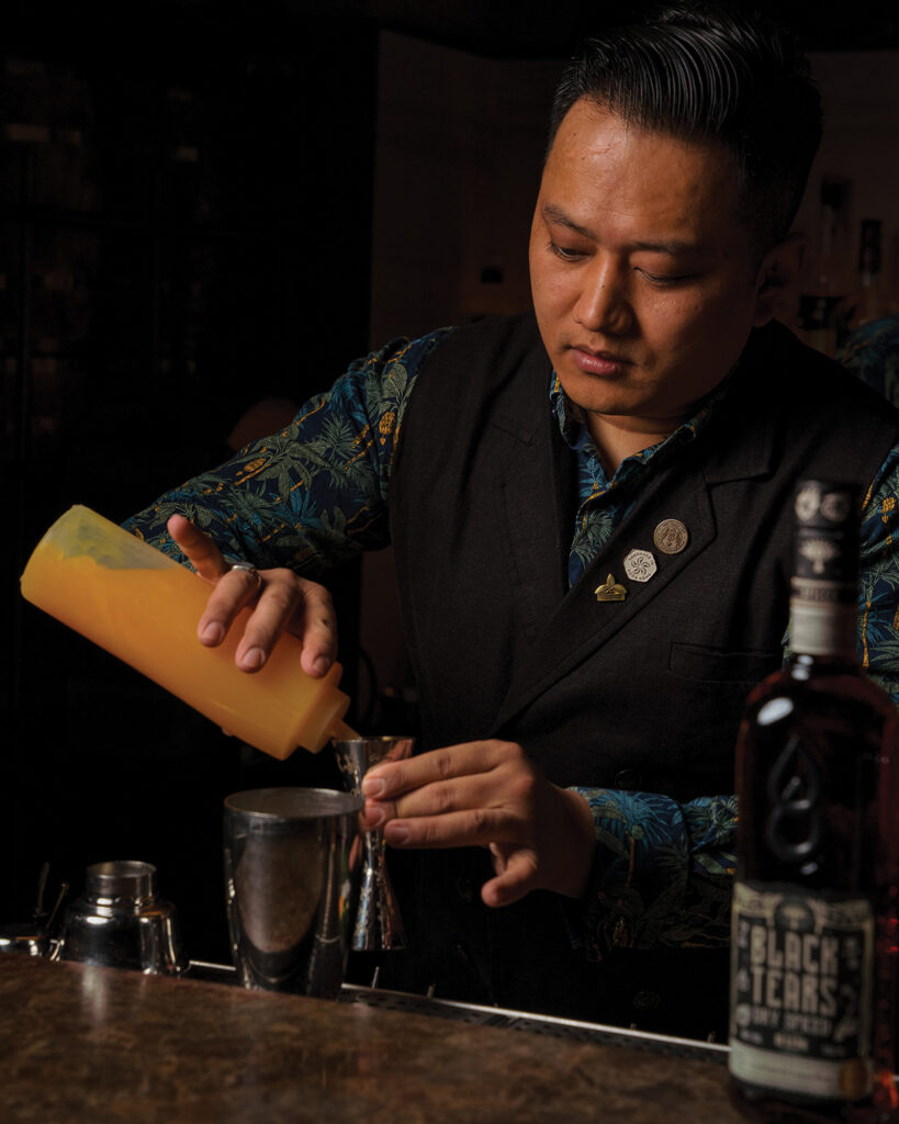 A mixologist making a mocktail at The Daily Tot in Hong Kong
